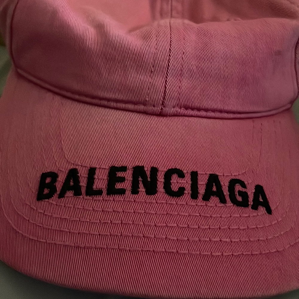 Pink Balenciaga hat.